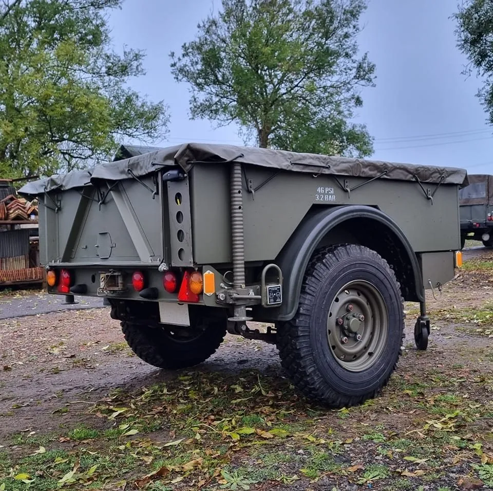 Penman trailer in olive green with a tarpaulin cover